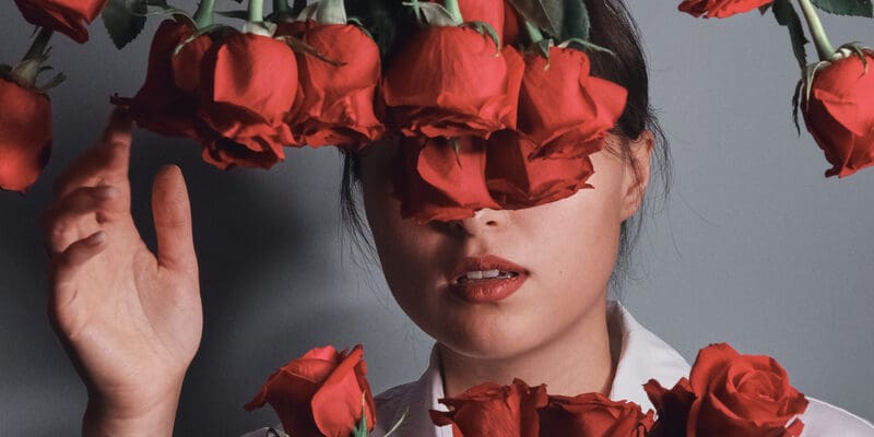 Red,Roses,Bouquet,And,Girl